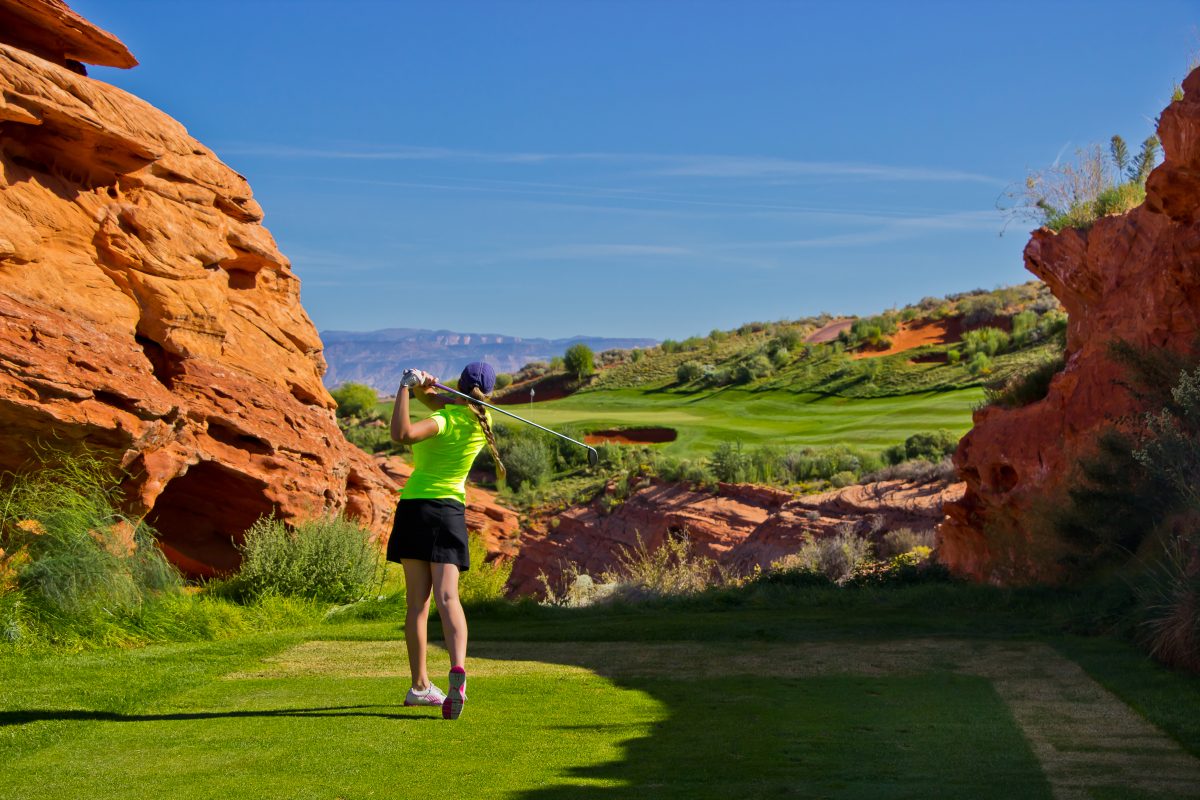 Teeing Off Between Red Rocks