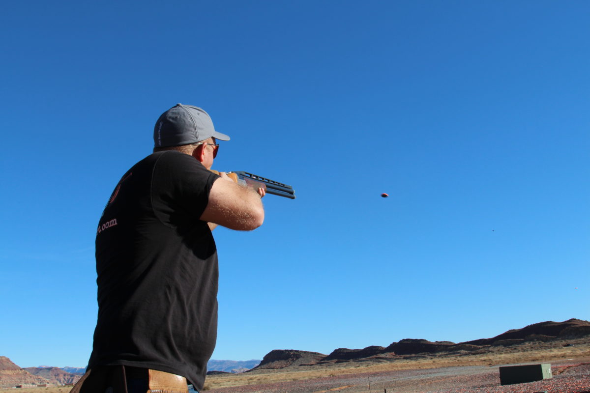 Man in T-Shirt Shooting Clay Pidgeon