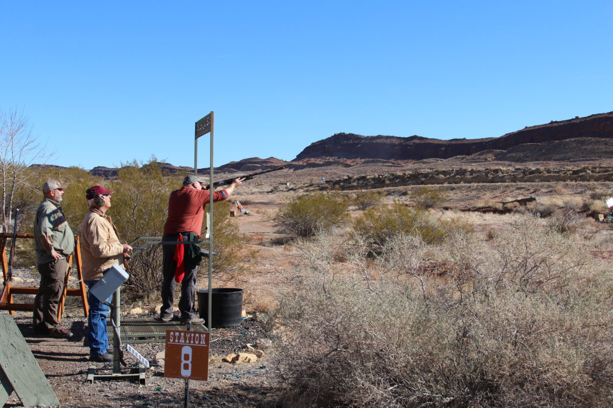 Wide View of Shotgun Shooter with Spectators