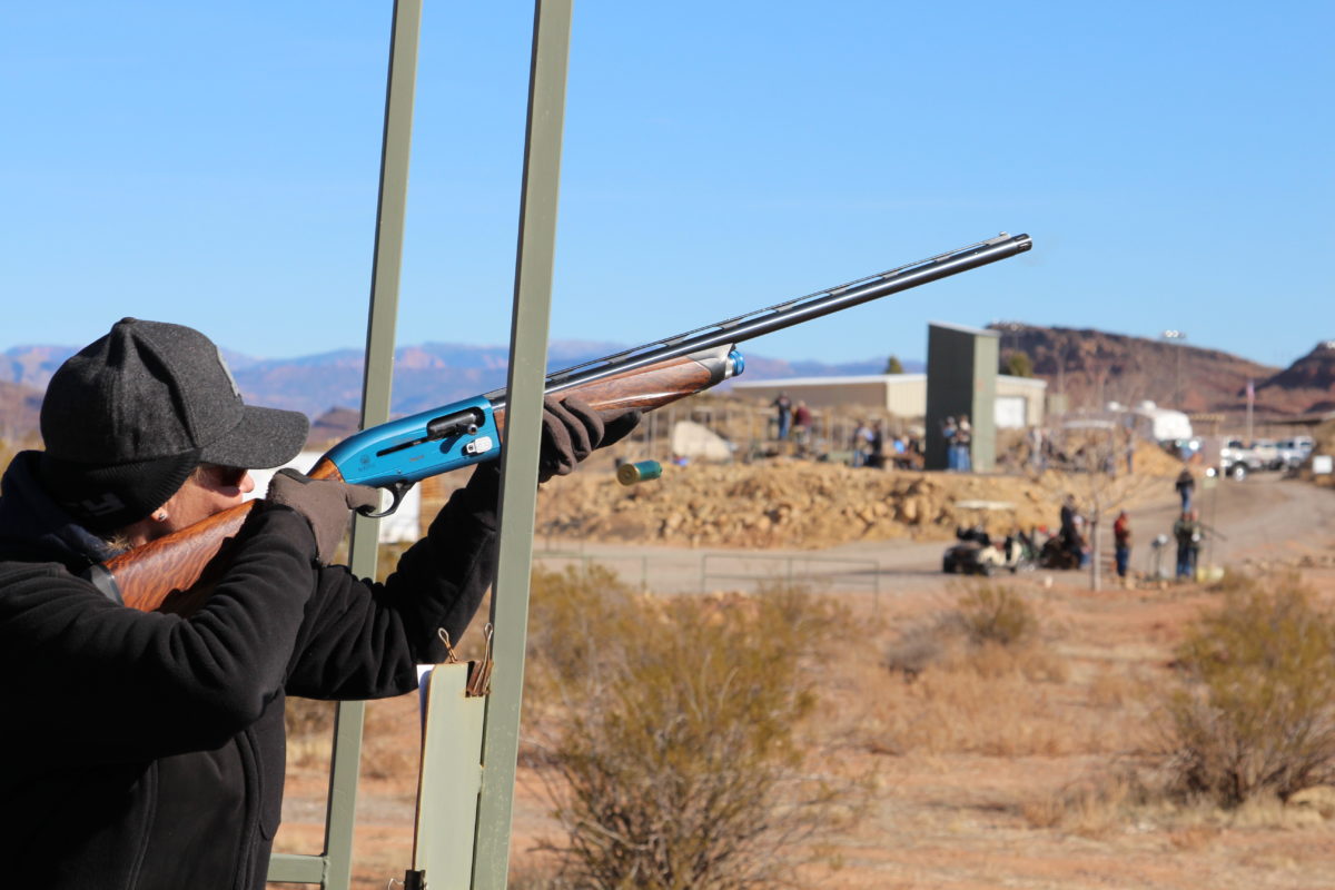 Woman Aiming Shotgun