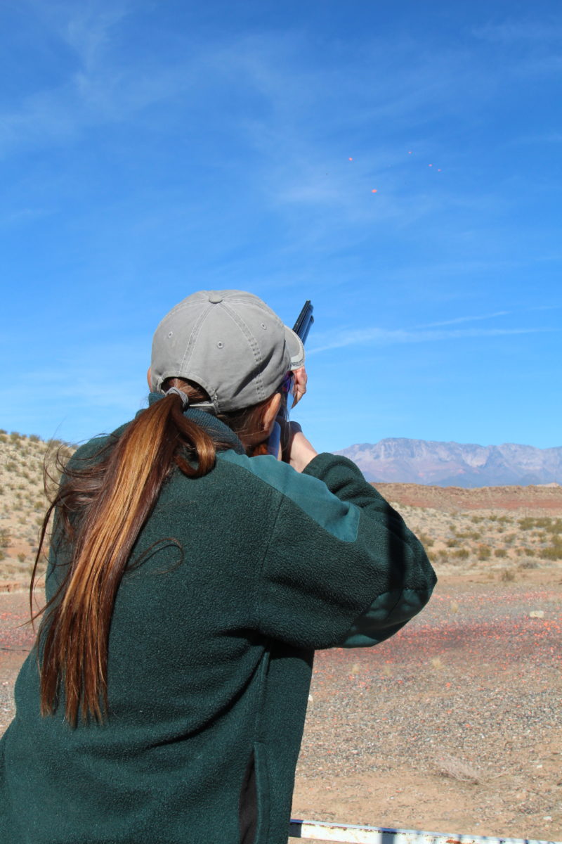 Rear View of Shotgun Shooting Woman