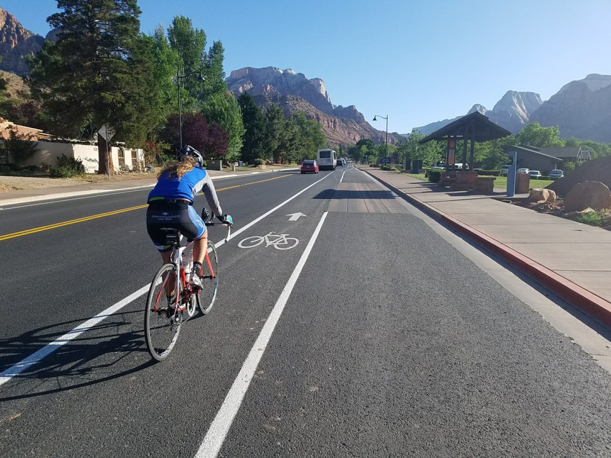 Woman Cycling through Springdale